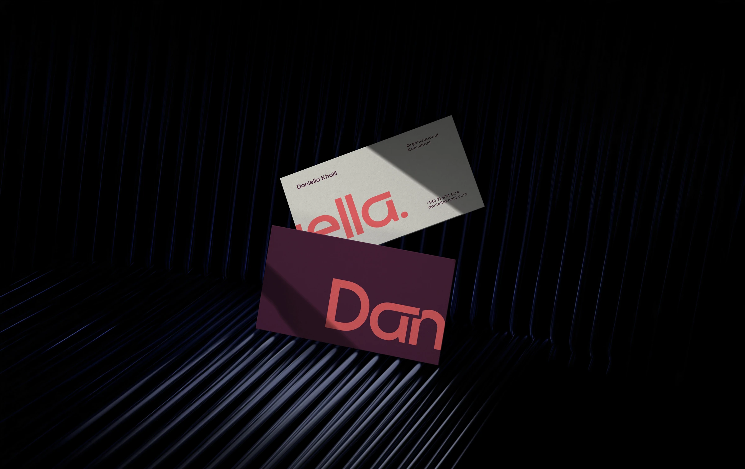 Daniella Khalil business cards with bold pink and burgundy lettering